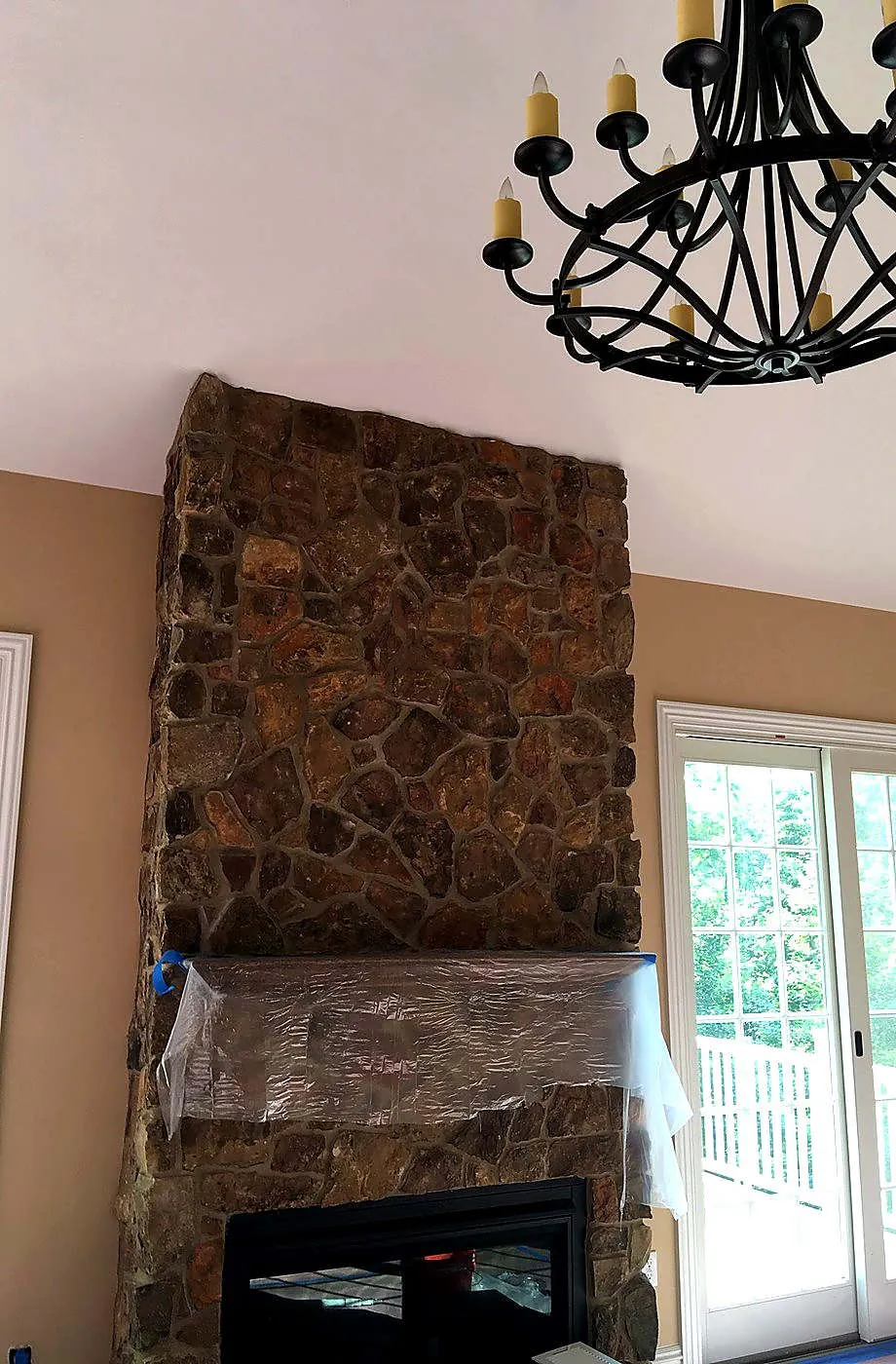 Open plan — stone, trim and a warm field — Maximum Painting Solution project