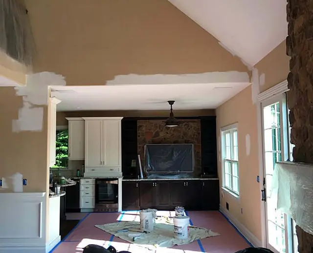 Stone, trim, and a warm field — Kitchen walls and casing
