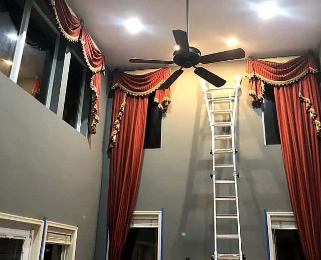 Block, piers, and a tall wall — Two-story wall around the mantel